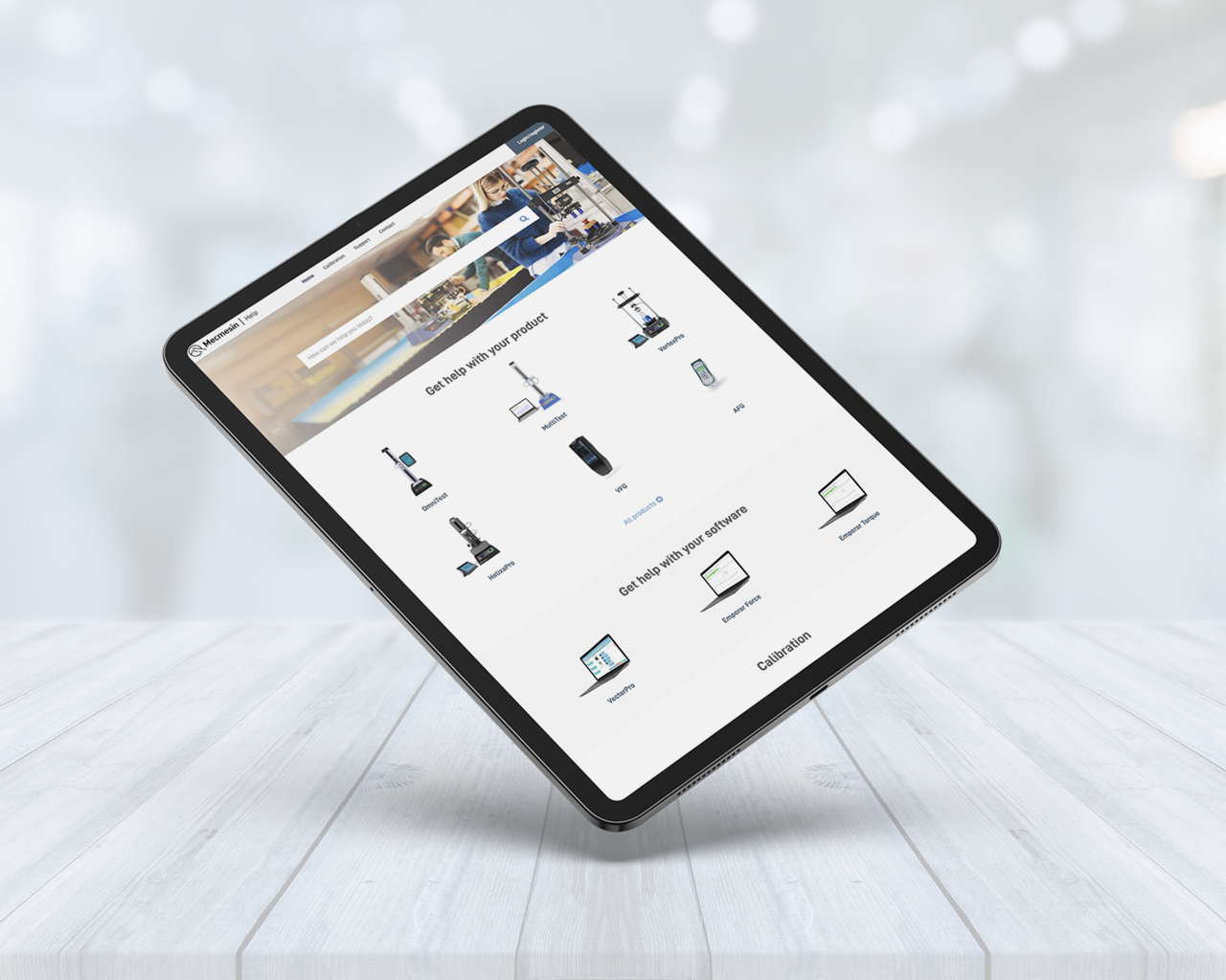 Photo of tablet browsing Mecmesin's online support centre (help.mecmesin.com)