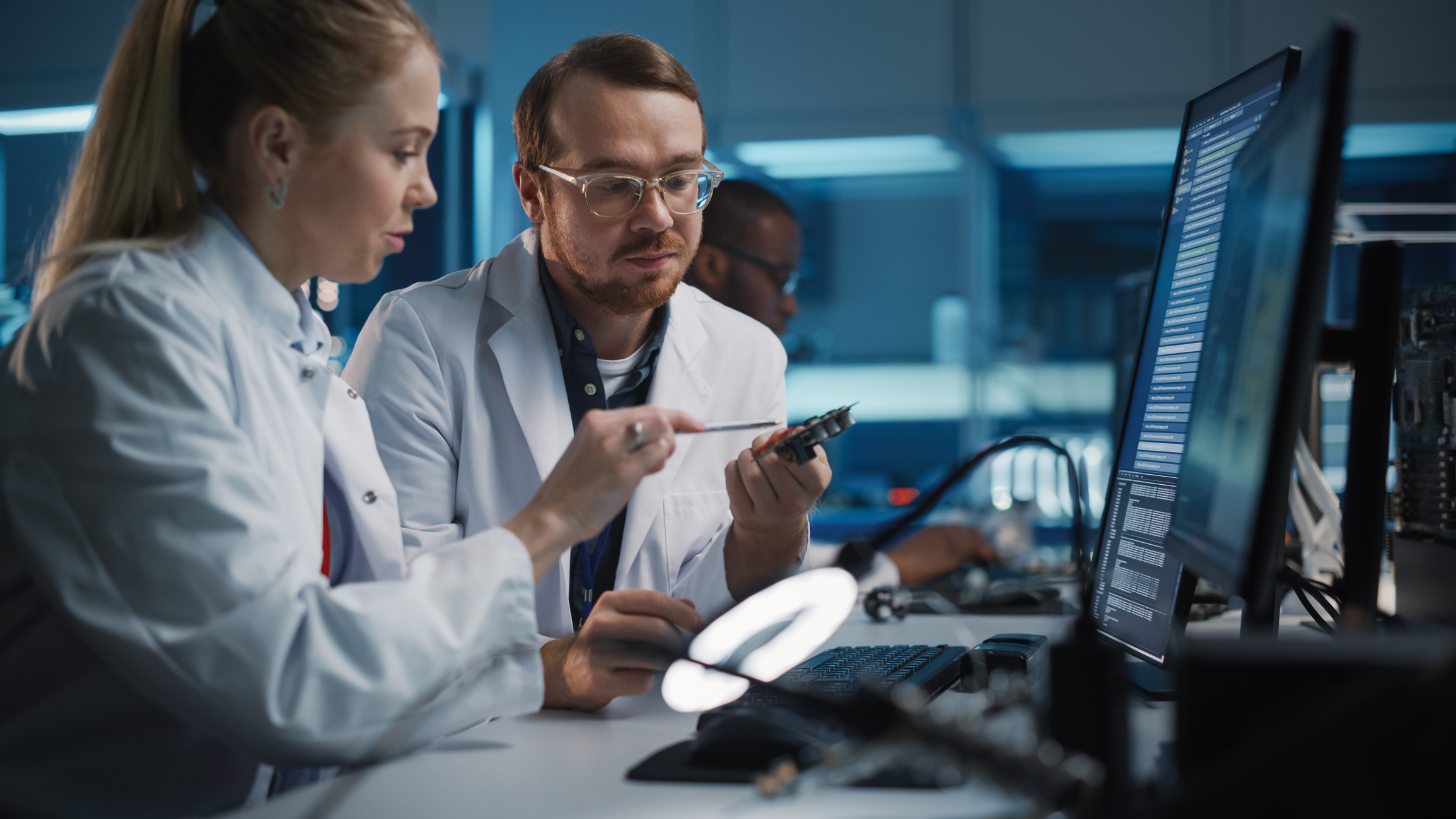 Stock photo of support engineer providing training to a lab technician