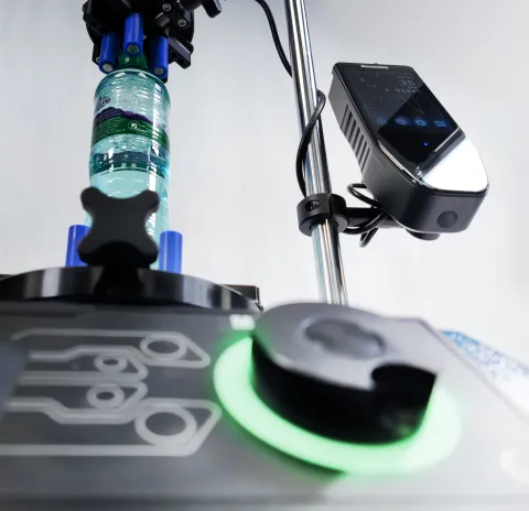 Mecmesin VFTI - Touchscreen force and torque indicator mounted on Mecmesin Vortex-dV torque testing stand