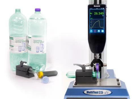 Custom fixture for bottle preform with the tethered closure being pulled and a selection of test specimens