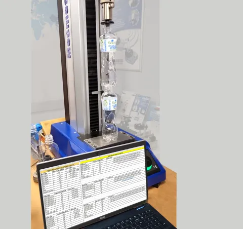 Compressive loading of stacked PLA bottles to measure column strength against traditional materials using Excel tabulated output data